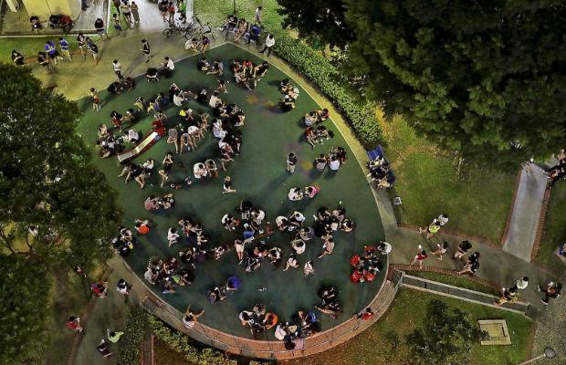 people at park for pokemon event