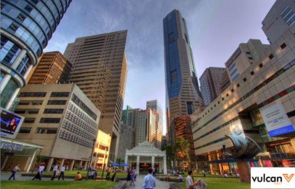 park in the city with people walking and relaxing