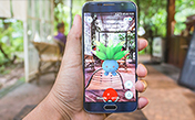 mobile phone with pokemon character on screen