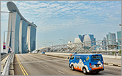 bus passing a road near marina bay sands