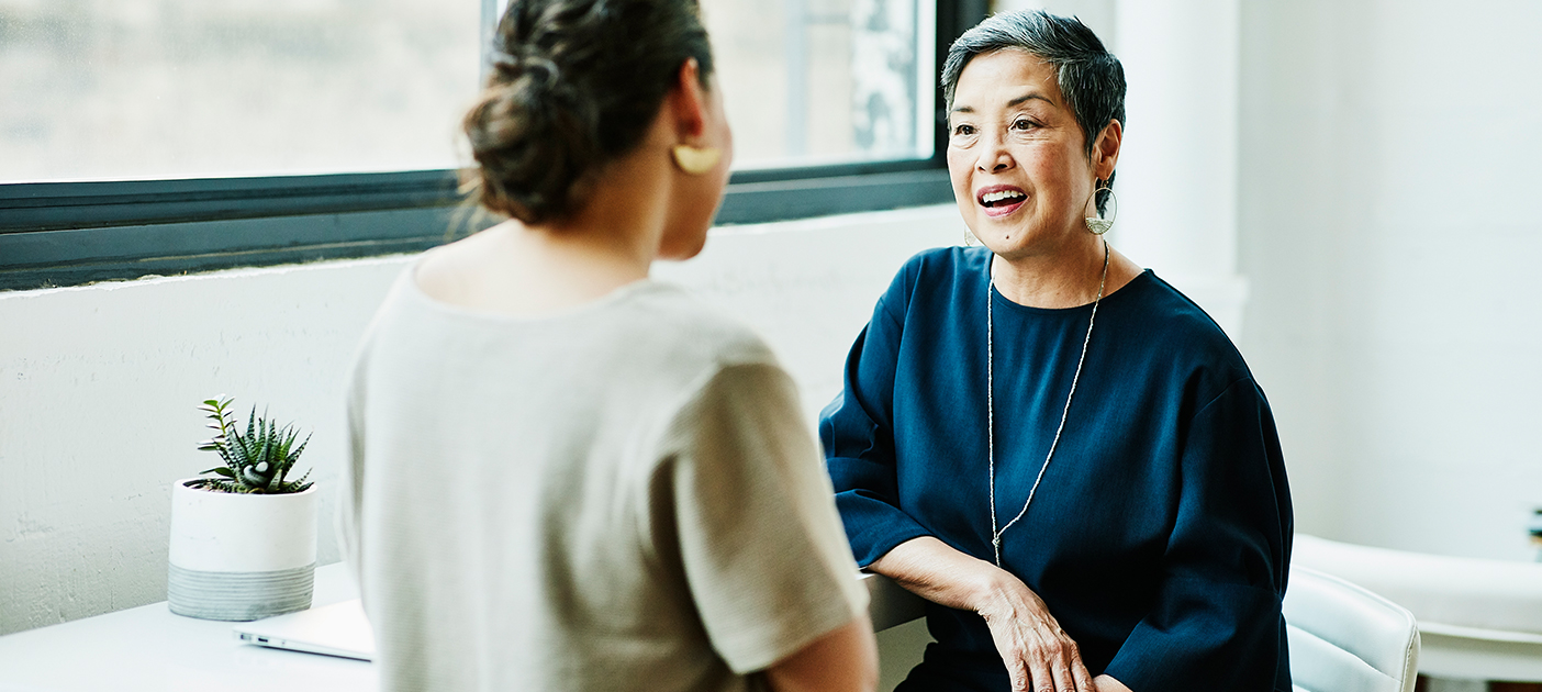 Two ladies discussing whole life insurance vs term insurance