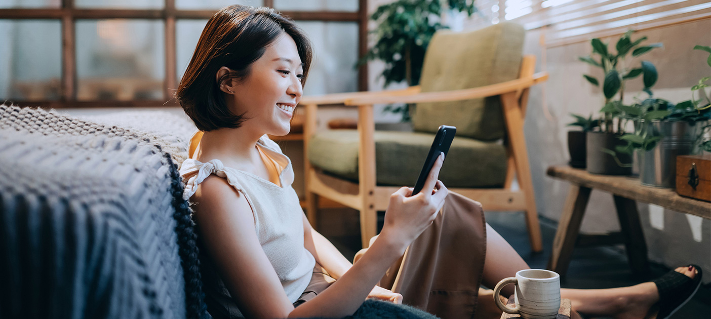 Woman using budgeting app to track her expenses