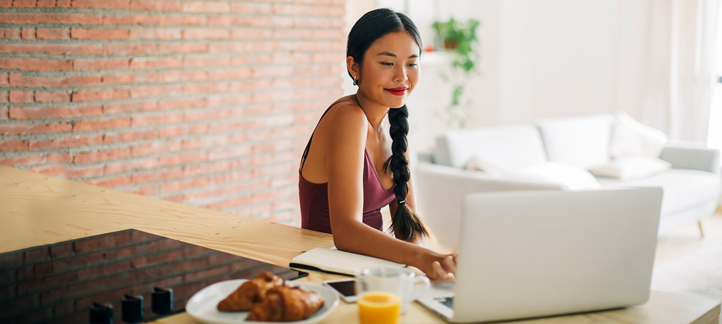 Woman smiles at the less volatile investment returns with dollar-cost averaging