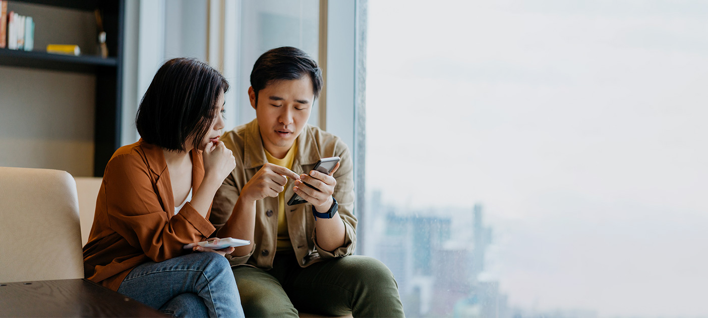 Young couple studying a list of money market and short duration funds