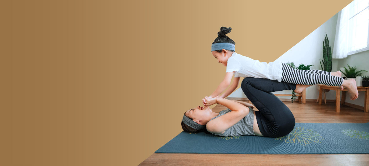 Mother stretching and balancing her daughter in a pilates pose; Life insurance is a useful tool to boost your wealth for retirement and legacy.