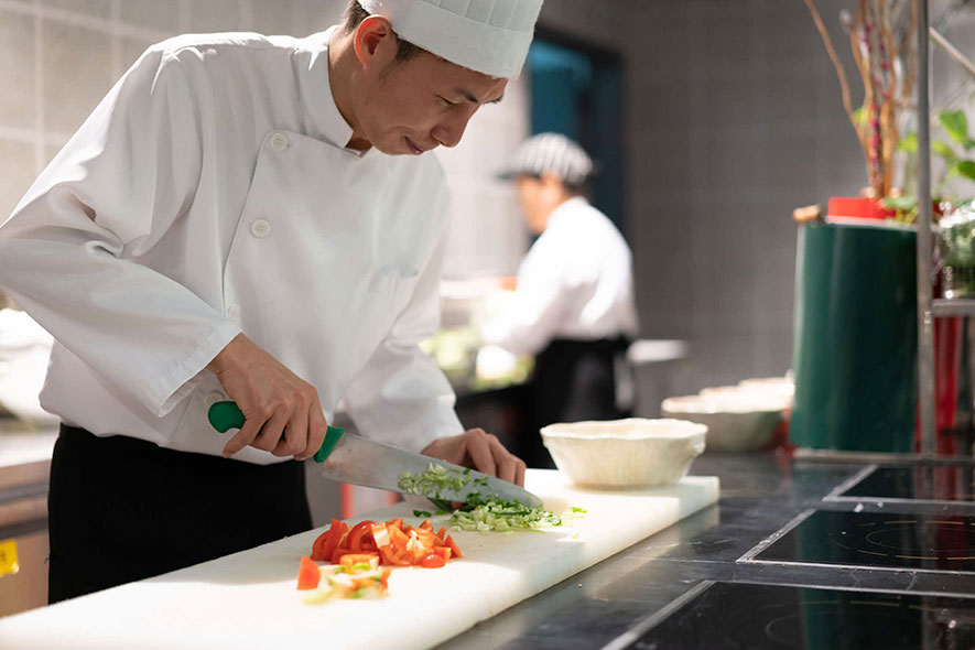 Chef chopping vegetables